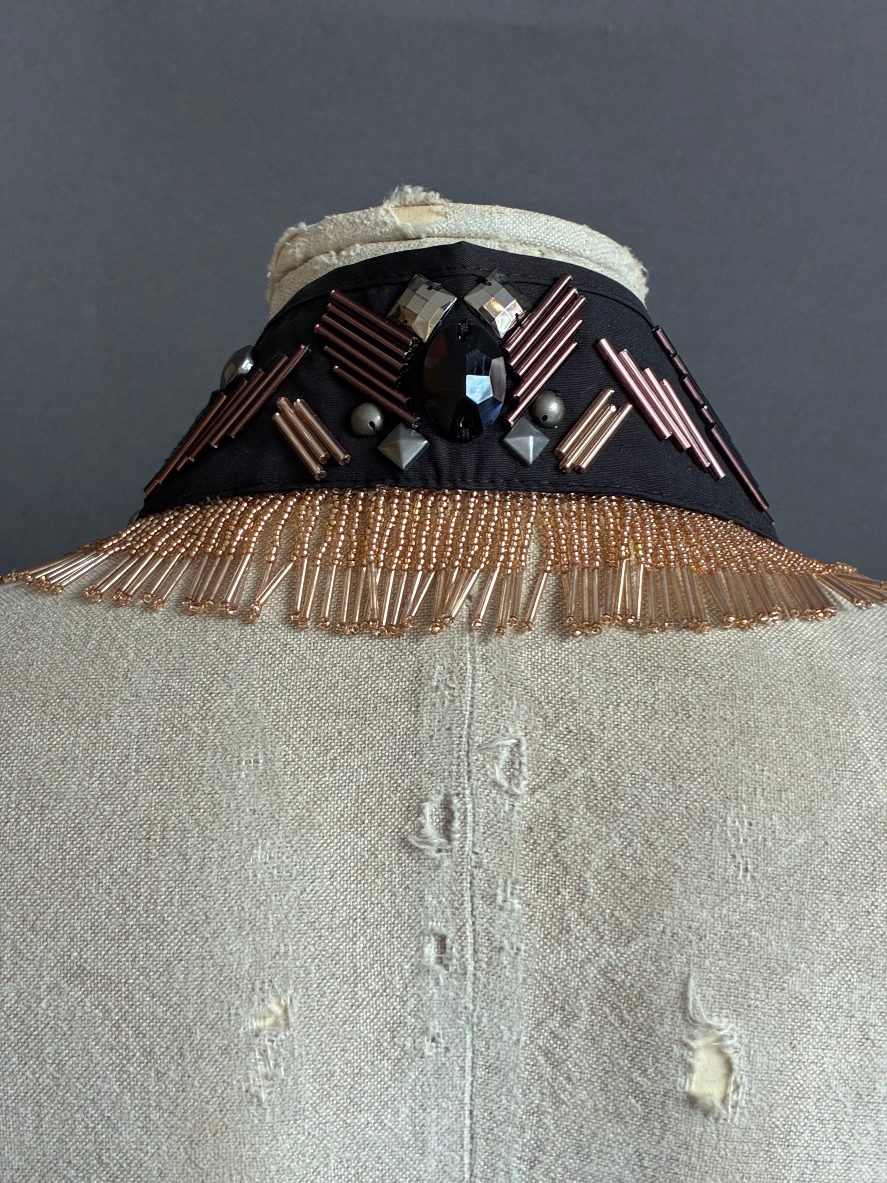 Cuello joya negro con flecos rosa nude y lazo | Óvalo